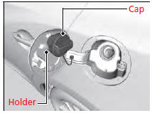 6. Insert the filler nozzle fully.